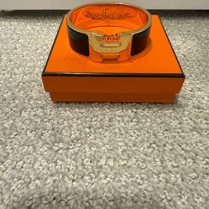 Hermès Clic Clac H Enamel Bracelet in Black and Gold